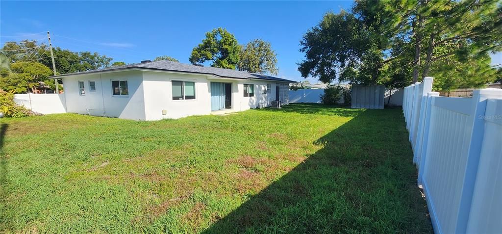 spacious yard with vinyl fence