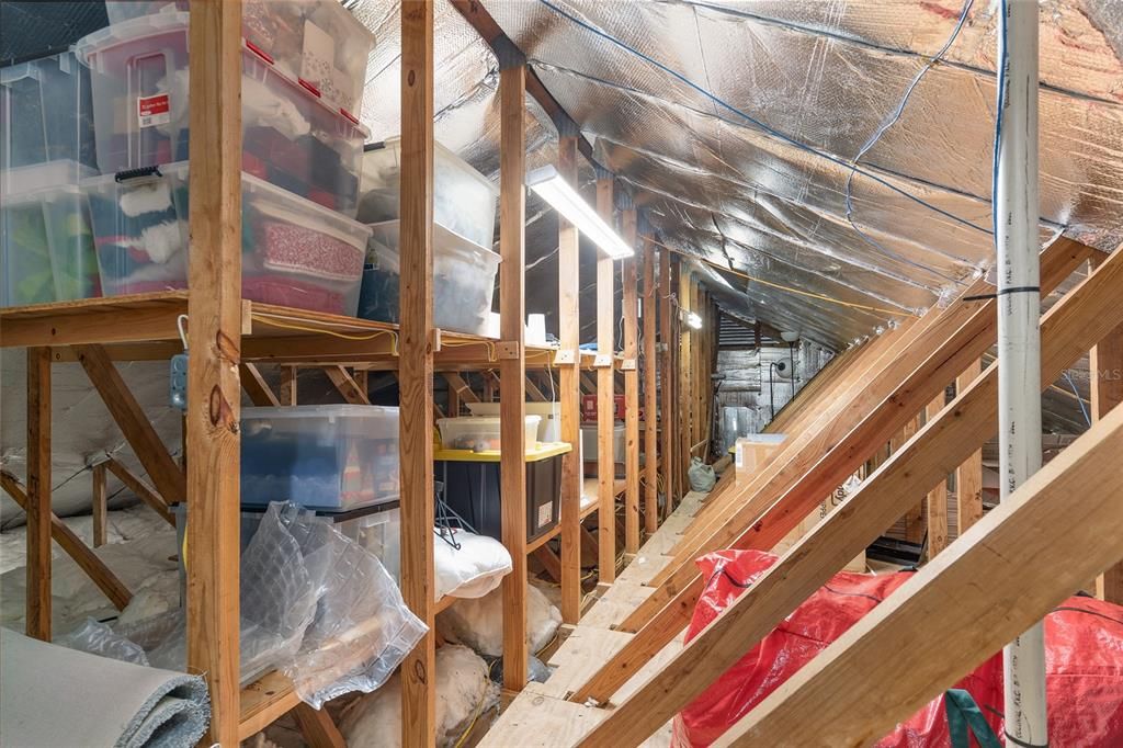 Walk-in attic storage over garage and family room