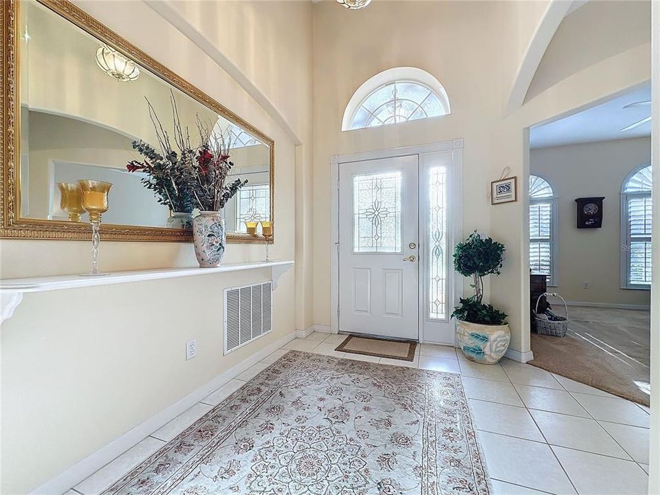 Entry foyer with leaded glass door and den entry