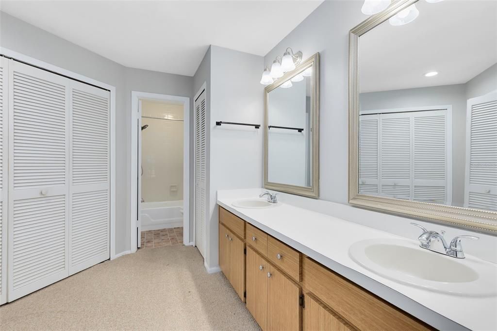 The primary ensuite bath includes dual sinks and a tub/shower combo.