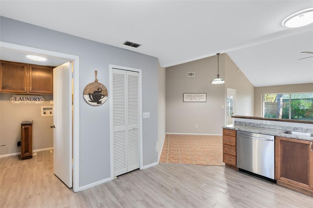 Just off the kitchen, you’ll find a large laundry room with ample cabinets for storage, making organization a breeze.