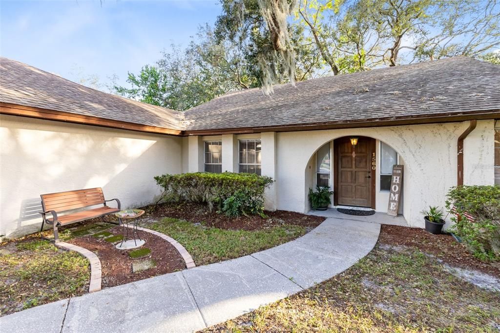 A charming front walkway guides you to the front door.