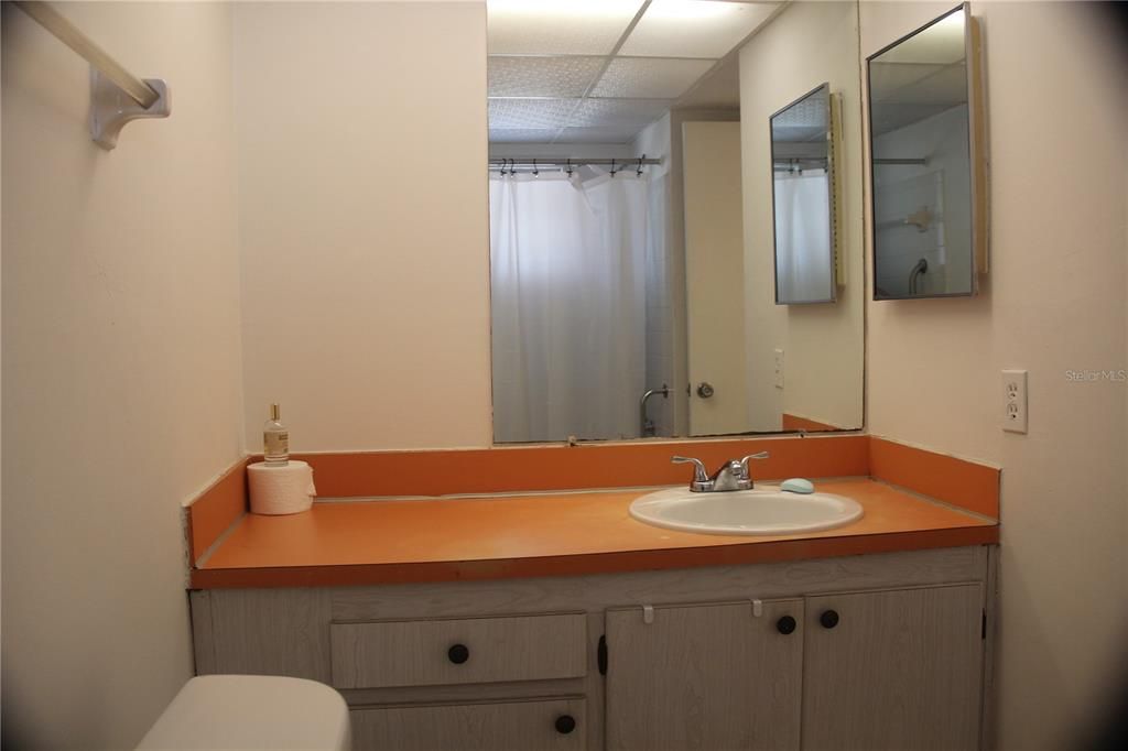 Bathroom features a tub/tile surround.