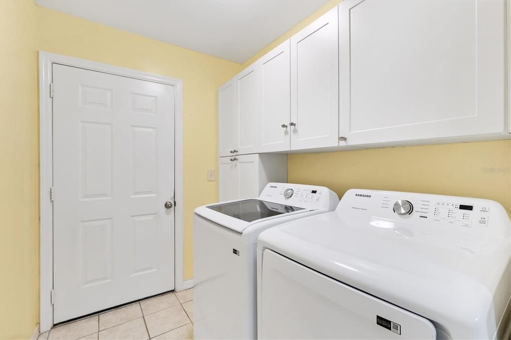 INSIDE LAUNDRY WITH NEWER WASHER & DRYER