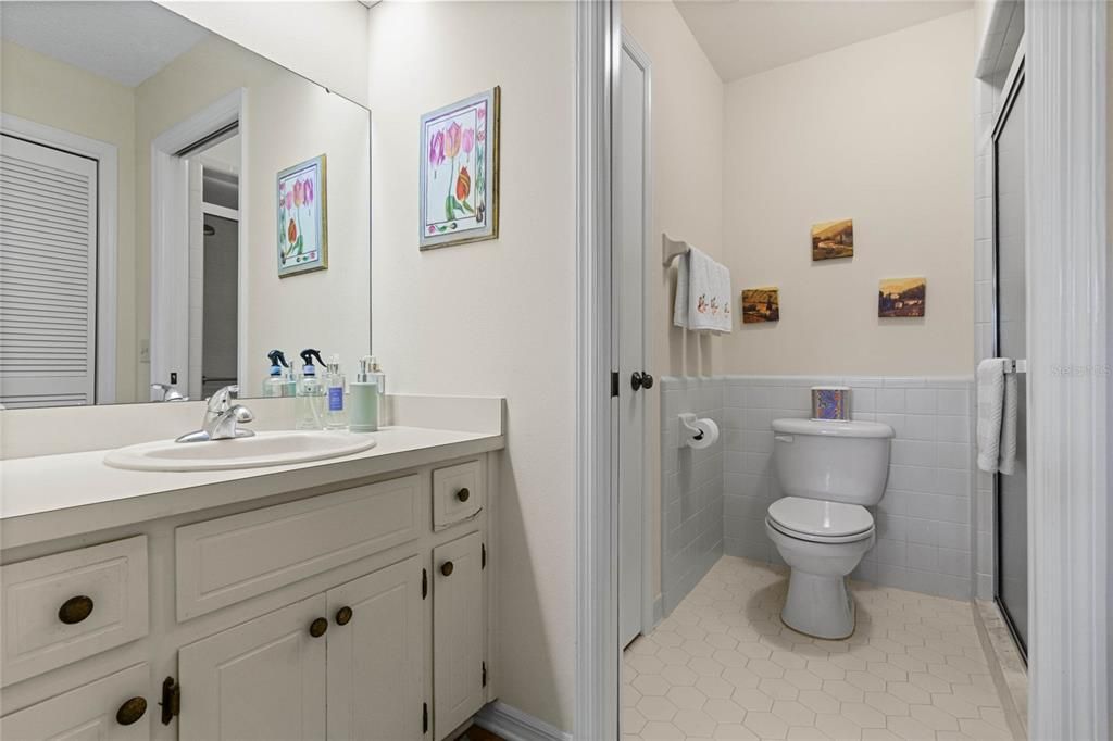 Primary Bathroom with Single Vanity and 2 Linen Closets