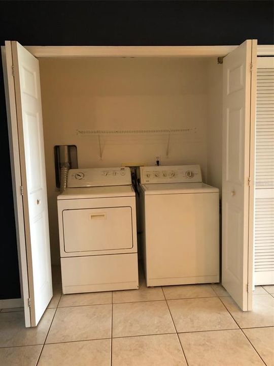 Laundry closet with washer & dryer.