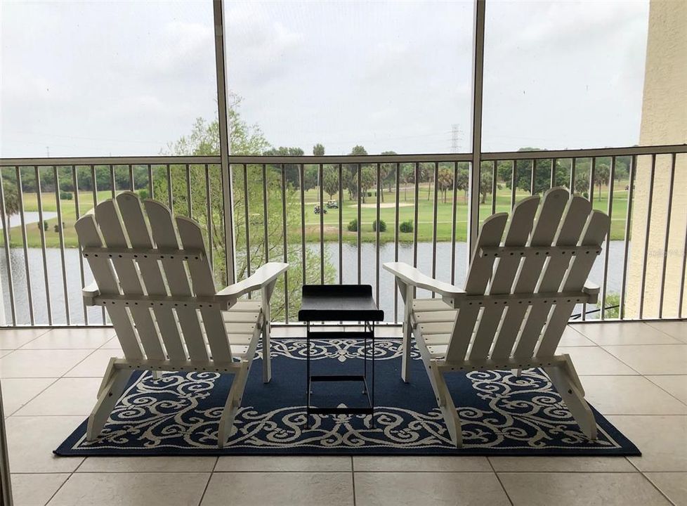 Screened terrace overlooking the lake and 18th fairway.