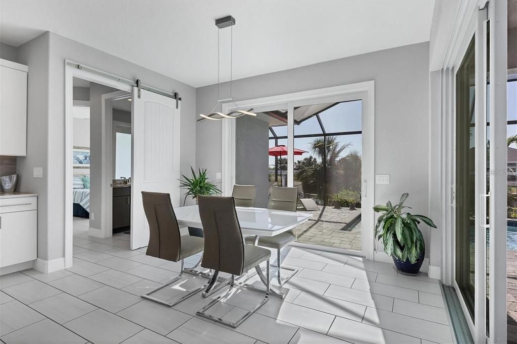 Barn door to separate guest bedrooms from dining