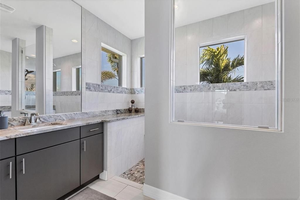 Modern ensuite featuring dual vanities