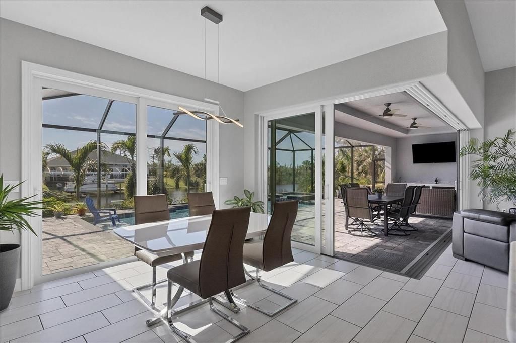 Airy dinning room with large dual sliders to sun deck