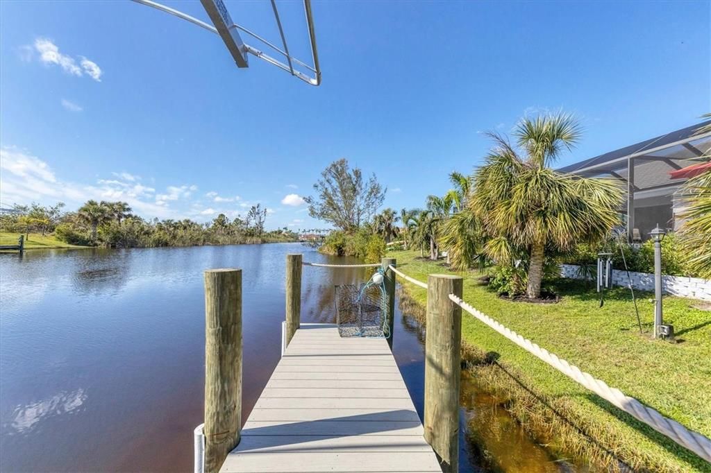 Direct access to the water via a durable composite dock with a 10,000 lb lift, canopy, water, and electric hookups—ideal for boating enthusiasts.