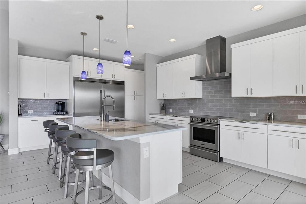 Modern kitchen showcasing a central island for culinary convenience.