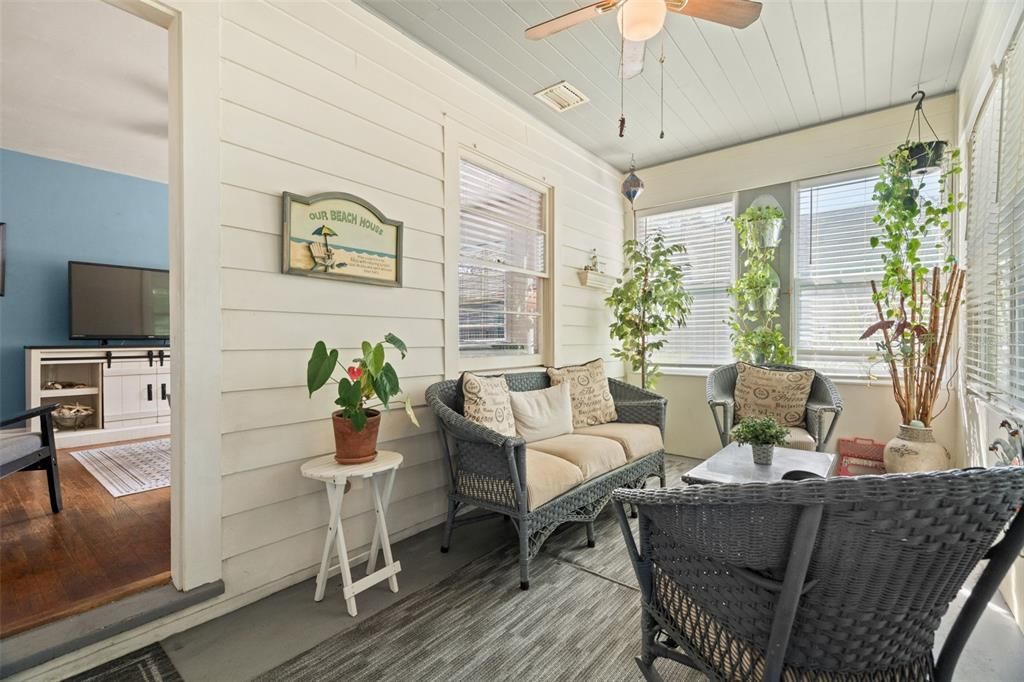 Enclosed front porch with views of Clymer Park