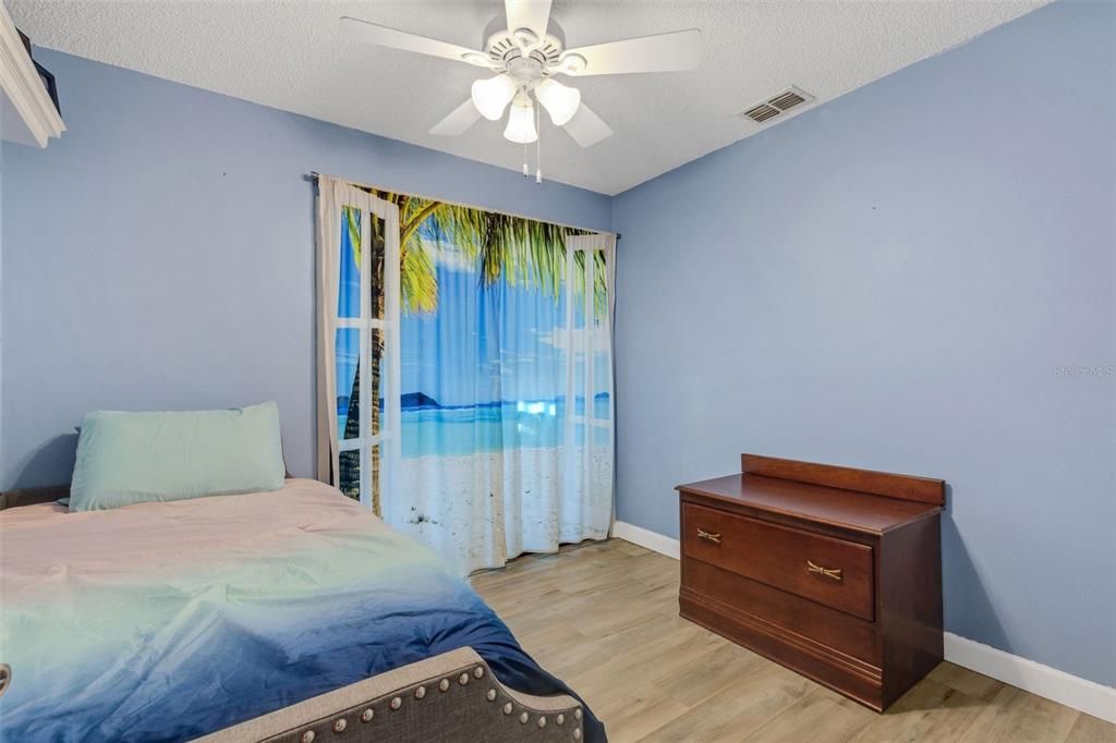 2nd Bedroom From Doorway Towards Sliding Glass Doors to the Bonus Room