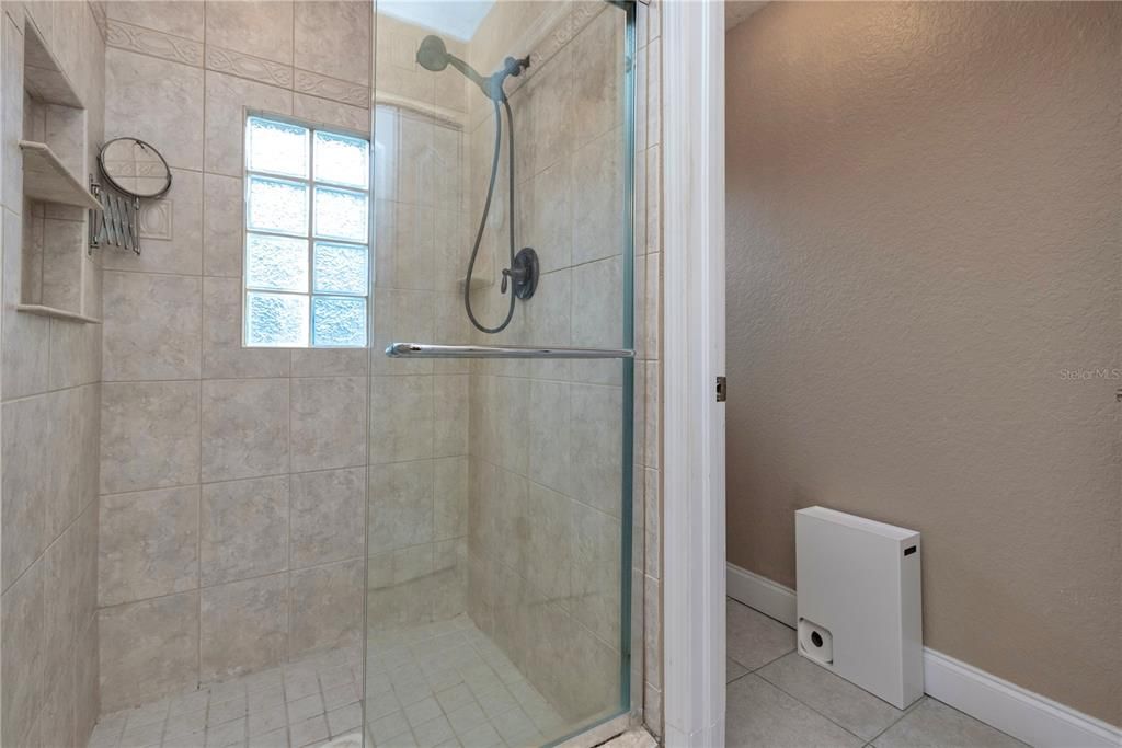 Walk-in shower and private water closet.