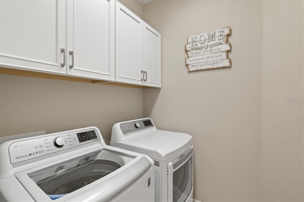 Laundry room is situated away from main living area lending to a quieter wash/ dry cycle.