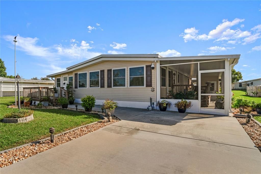 Front of home with screened in Lanai