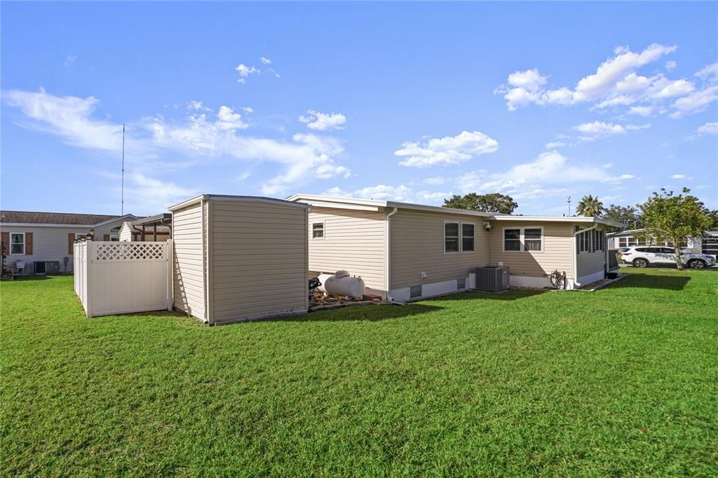 Back yard with storage shed.