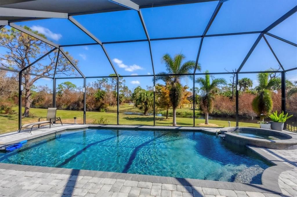 Relax & unwind in your private heated pool & spa that overlook a canal