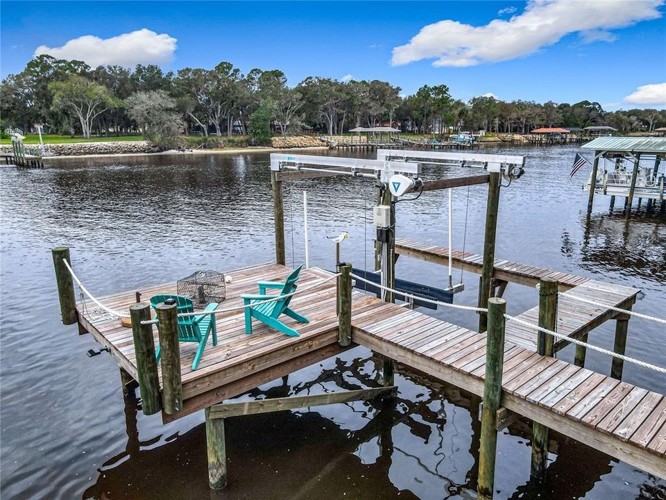 View of sitting area on dock and Boat Lift