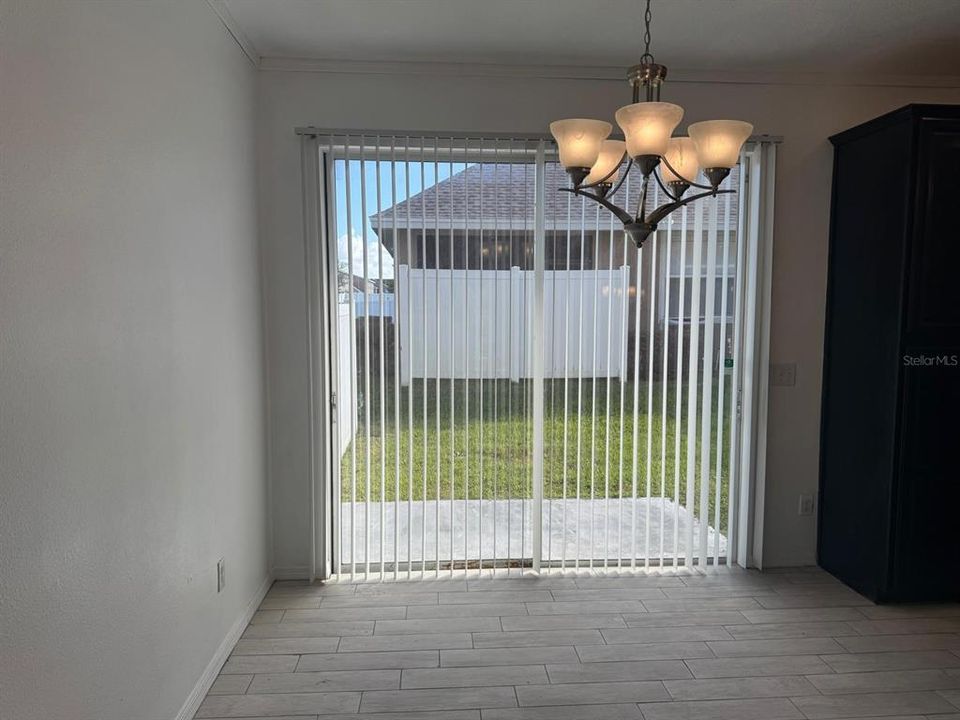 Dining room area with sliding door that leads to the backyard