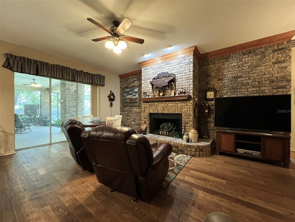 family room - notice classic fireplace & brick wall