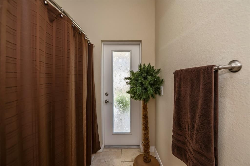 Bathroom #2 with door to the lanai.  Ease for using facilities without going throuh the house when outdoors.