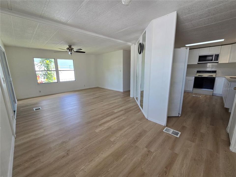 View from dining room towards living room and kitchen