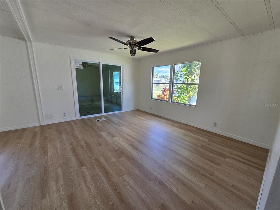 View from hall towards enclosed porch with sliders