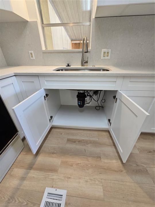 New plumbing and disposal, new cabinets