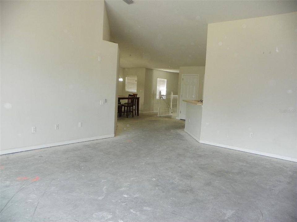 Living room looking toward kitchen and dining room