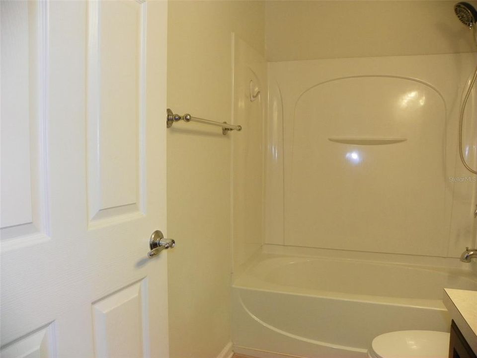 Guest Bathroom with door to additional entrance