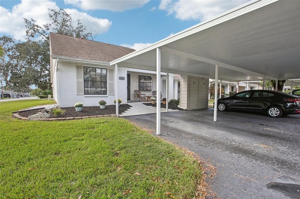 Expanded walkway and beautifully landscaped for easy maintenance.