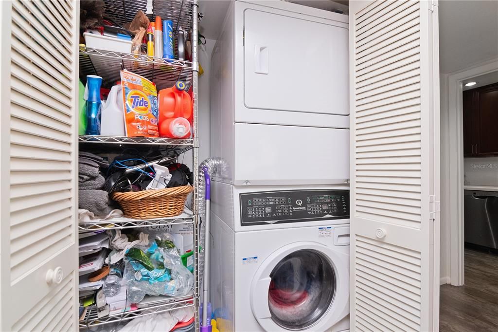 Laundry closet next to kitchen