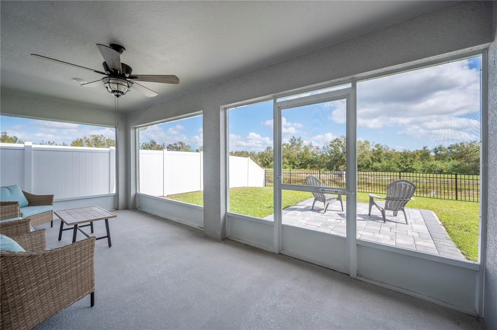 Large screened in patio with privacy fencing and a view!