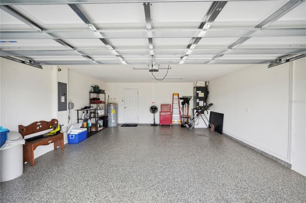 Two car garage with professionally installed epoxy coating for easy cleaning