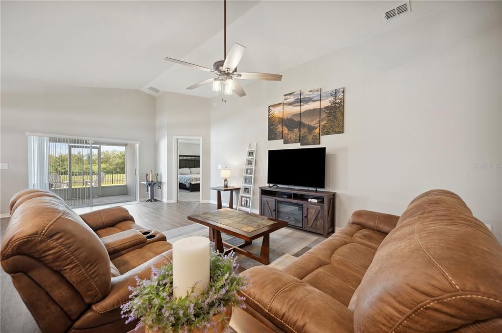 Glass sliding doors to your screened in patio with a view!