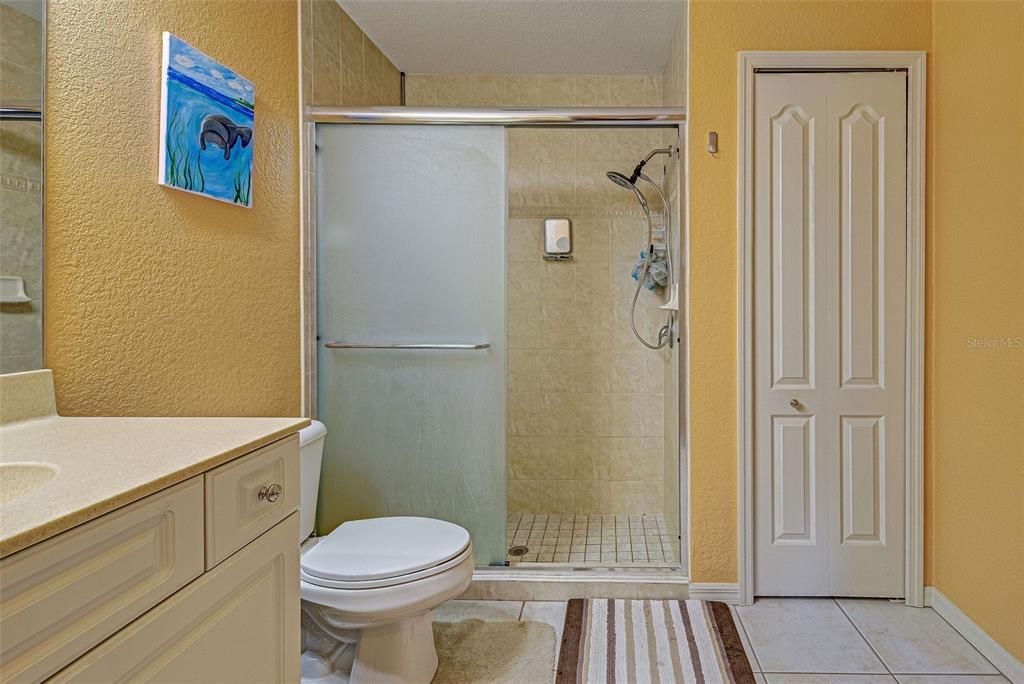 The primary bath has a large walk in shower and a linen closet.