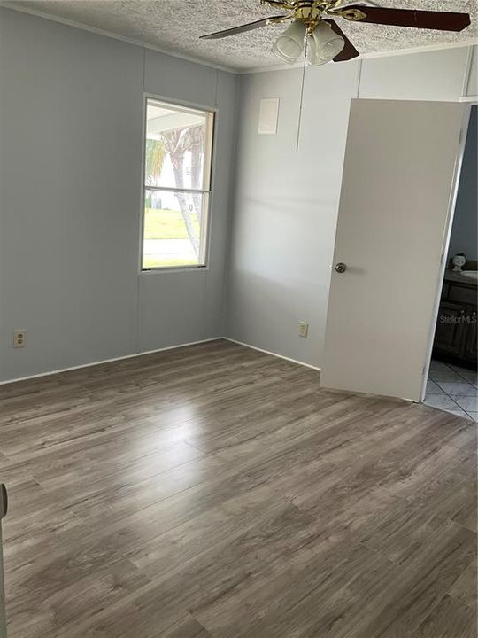 Master bedroom with new laminate flooring