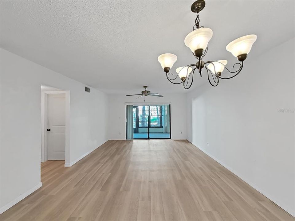 Dining Area and Living Room with view out to pond.