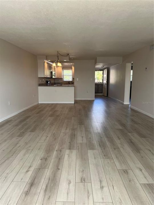 Living room view to kitchen and entrance