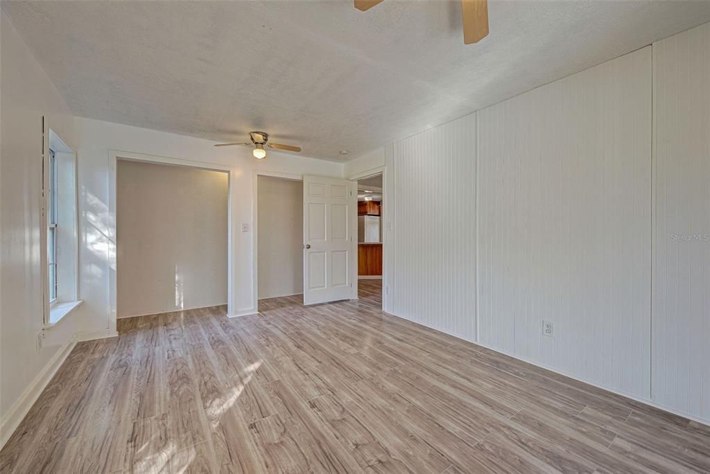 From the hallway, step into the primary bedroom with two large built in closets.