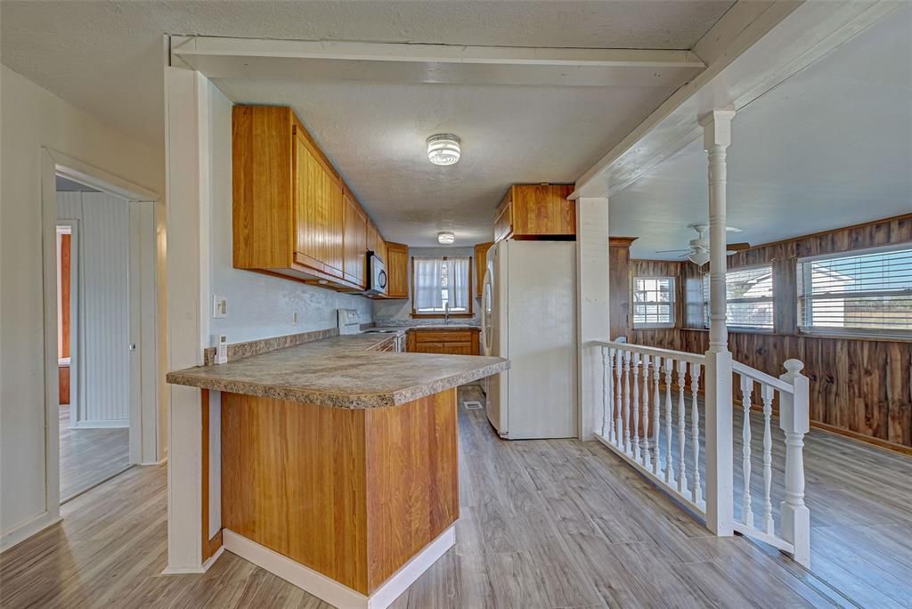 The galley kitchen has ample cabinet and counter space.