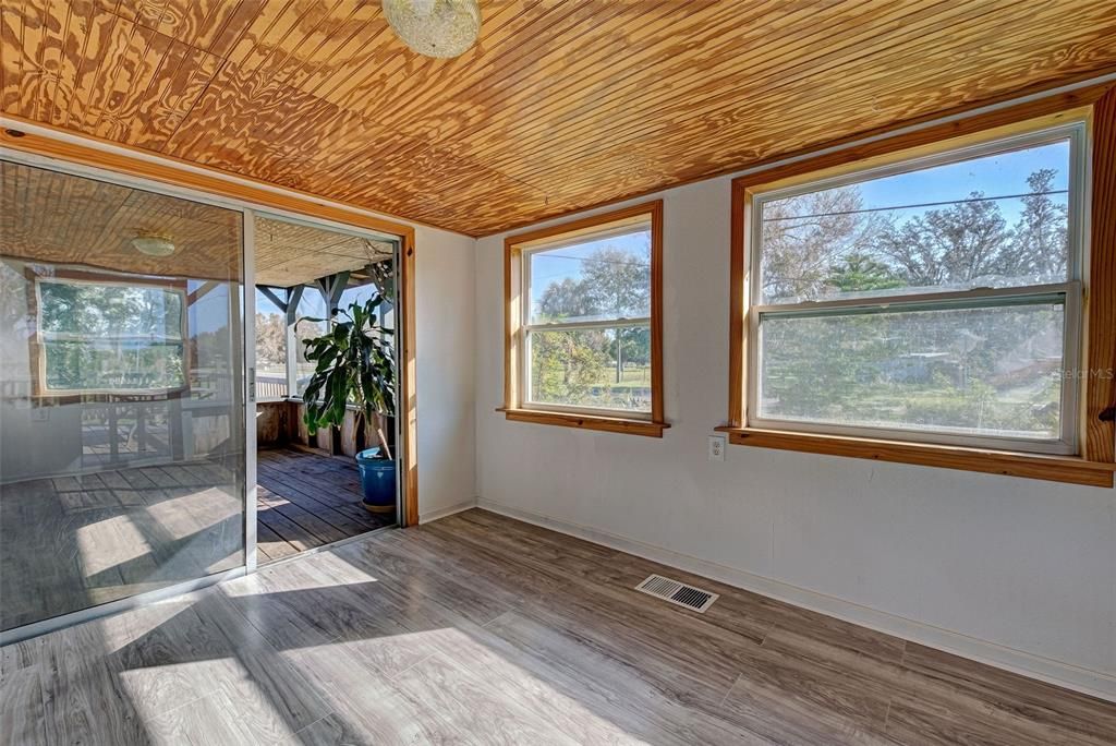 There is a sliding door from the second bedroom to the screened in porch.