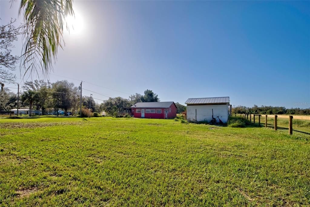 A panoramic view of the property.  Just under 1/2 acre.