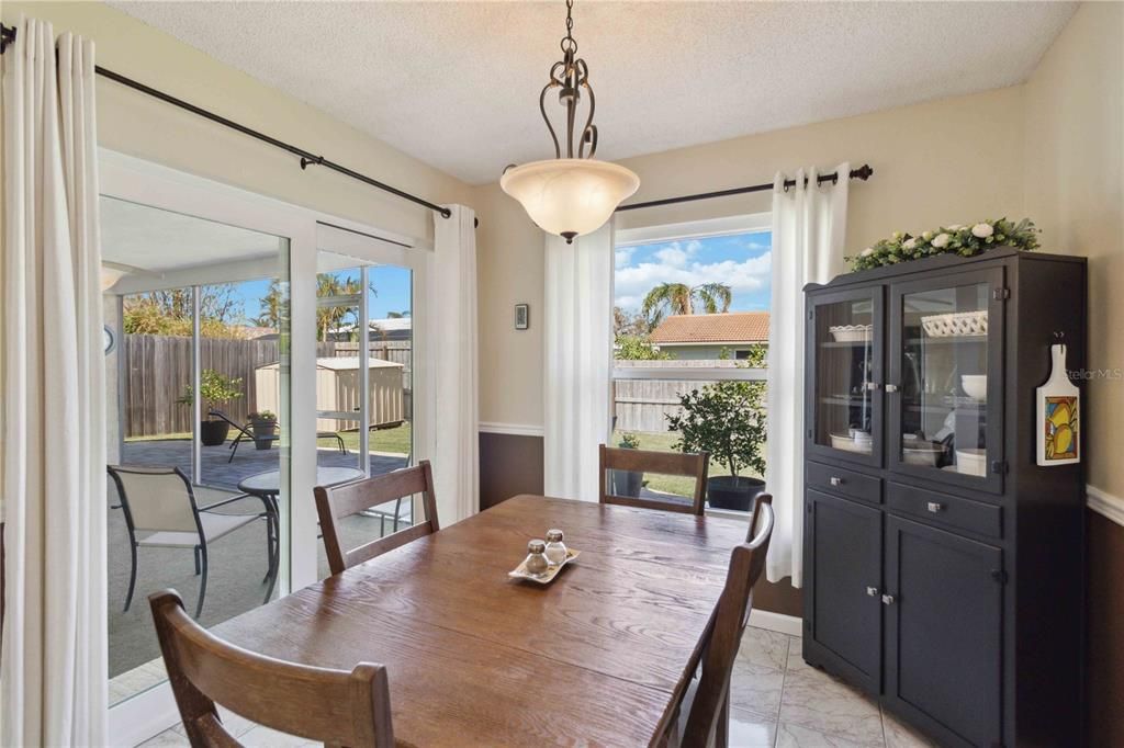 Bright eat-in kitchen dining area with patio access.