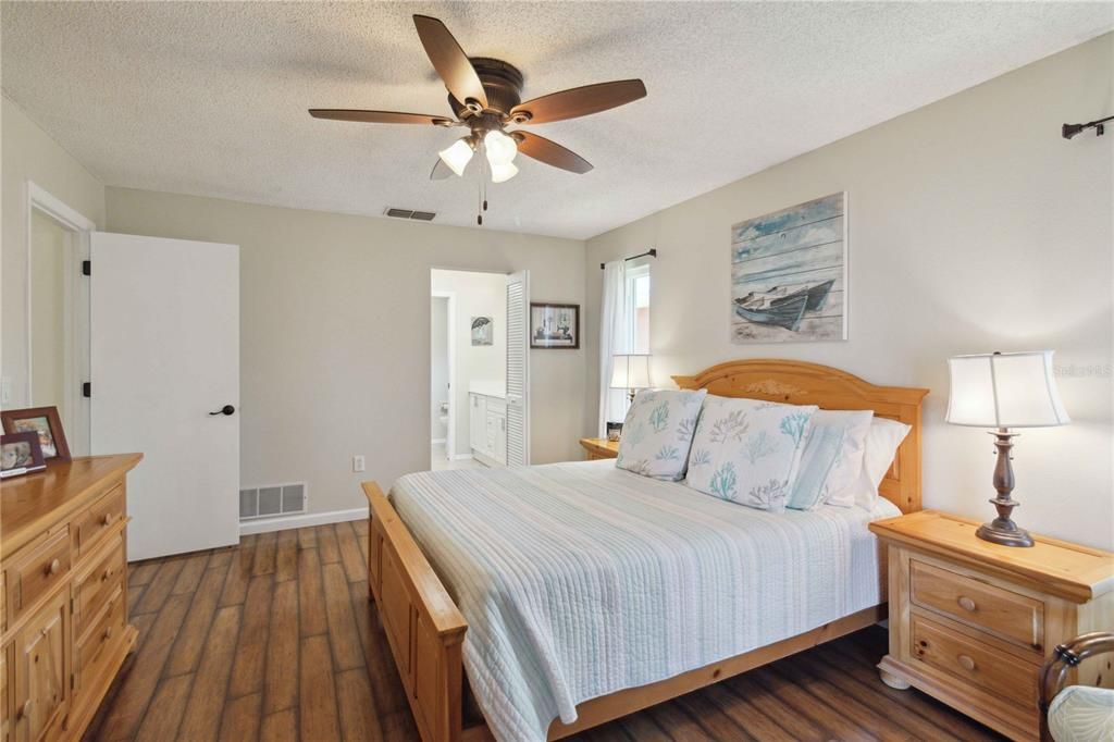 Spacious primary bedroom with walk-in closet and ensuite bathroom.