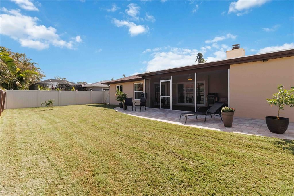 Spacious patio with pristine landscaping.