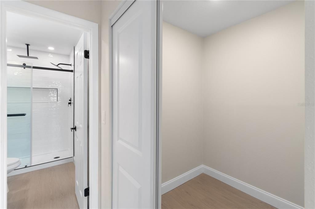 Walk in closet. Ensuite bath with Walk in Shower, Rimless doors with rainshower