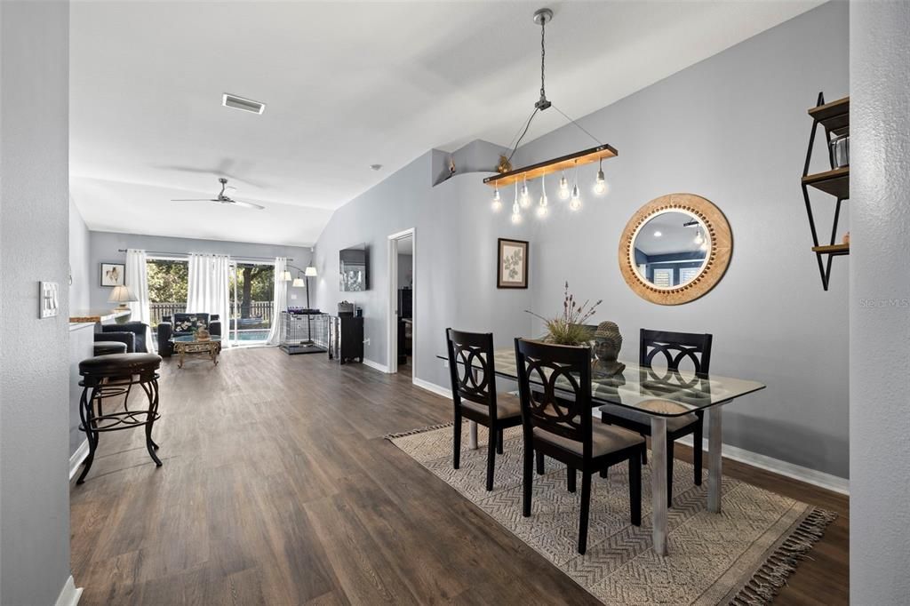 A dedicated dining area with designer chandelier and luxury vinyl flooring through most of the house.